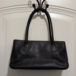 Kate Spade black ‘punched Noel’ leather top-handle bag.